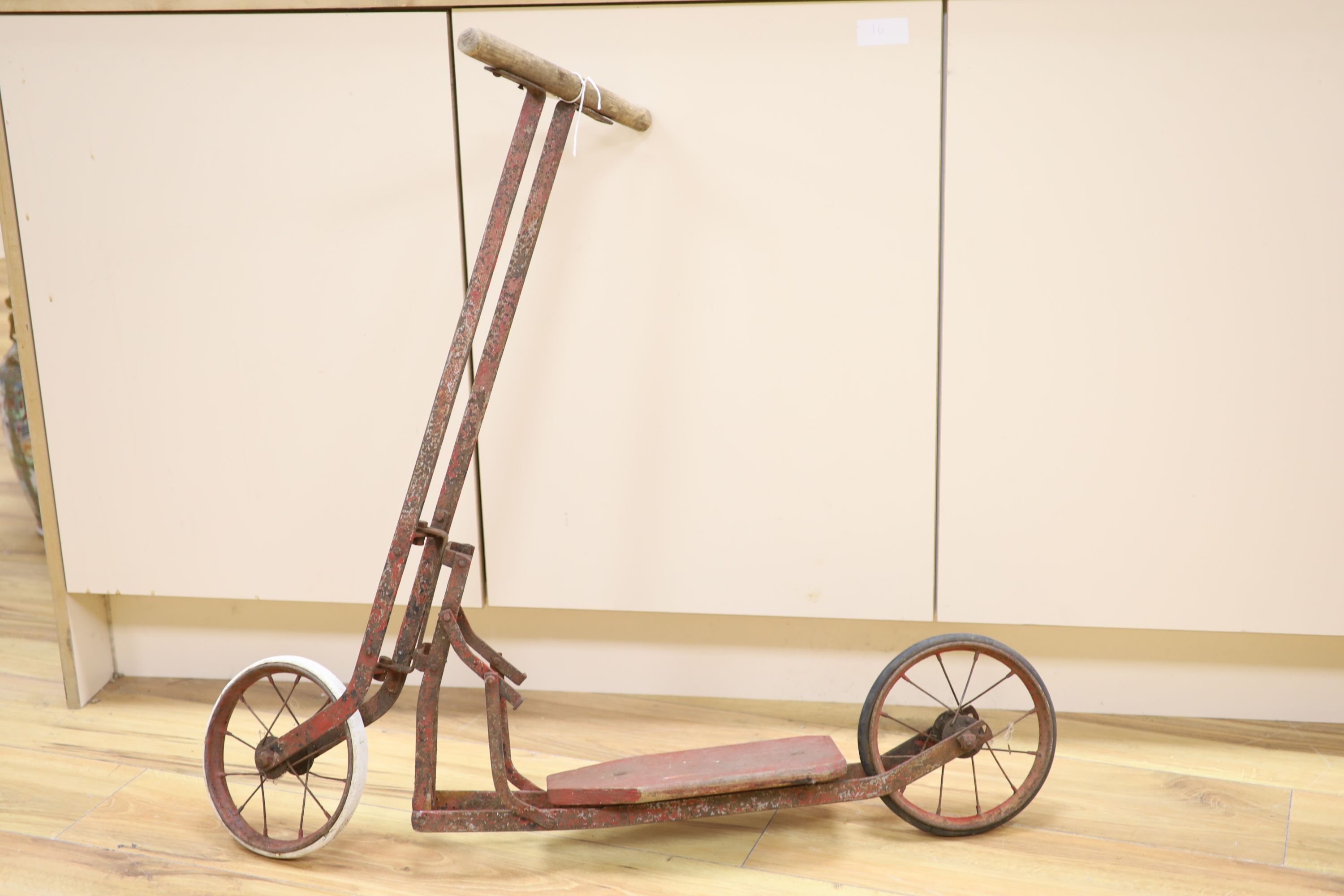 A childs folding scooter